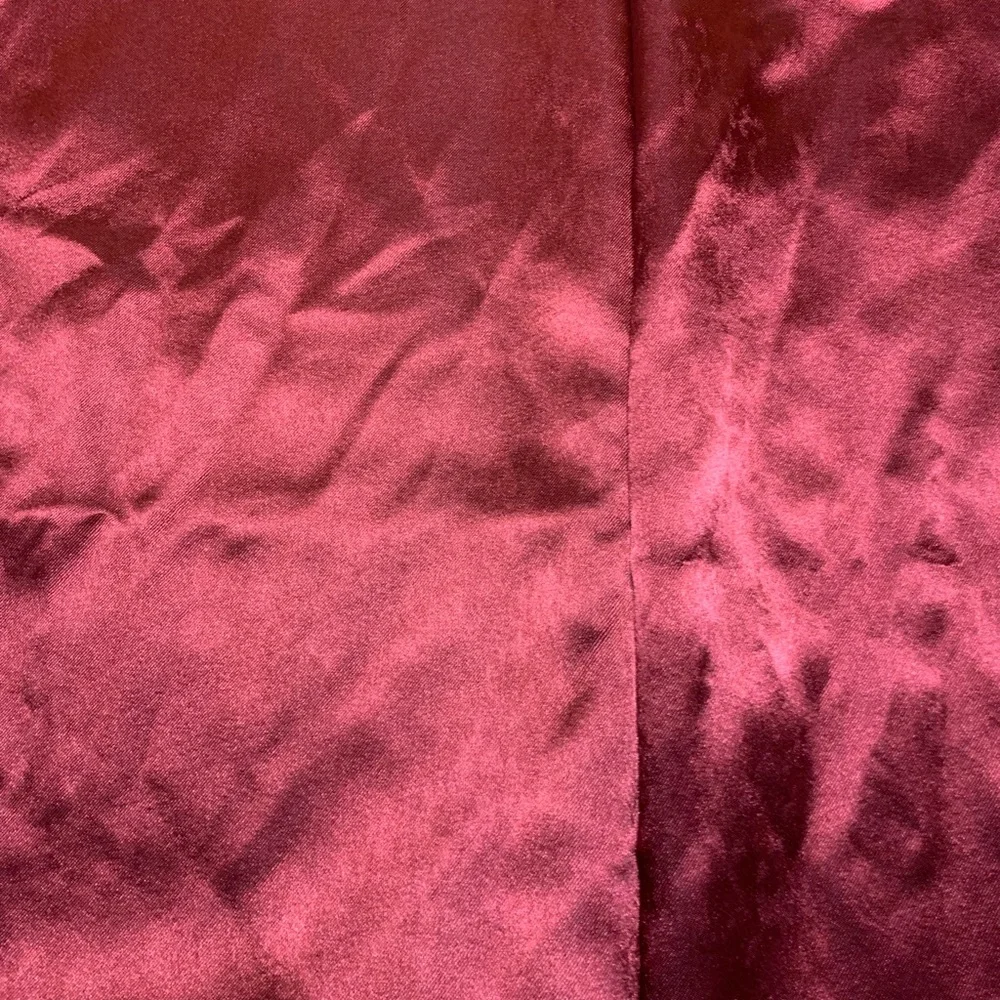 1 pair of burgundy/wine and silver curtains 28” x 84” each panel